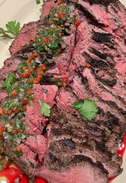 Grilled steak topped with Benny chimichurri
